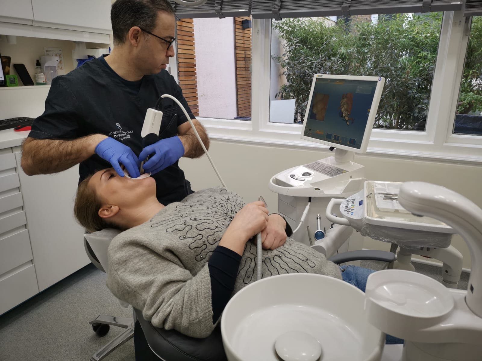 Dr Firas Daoudi using digital scanning in clinical practice
